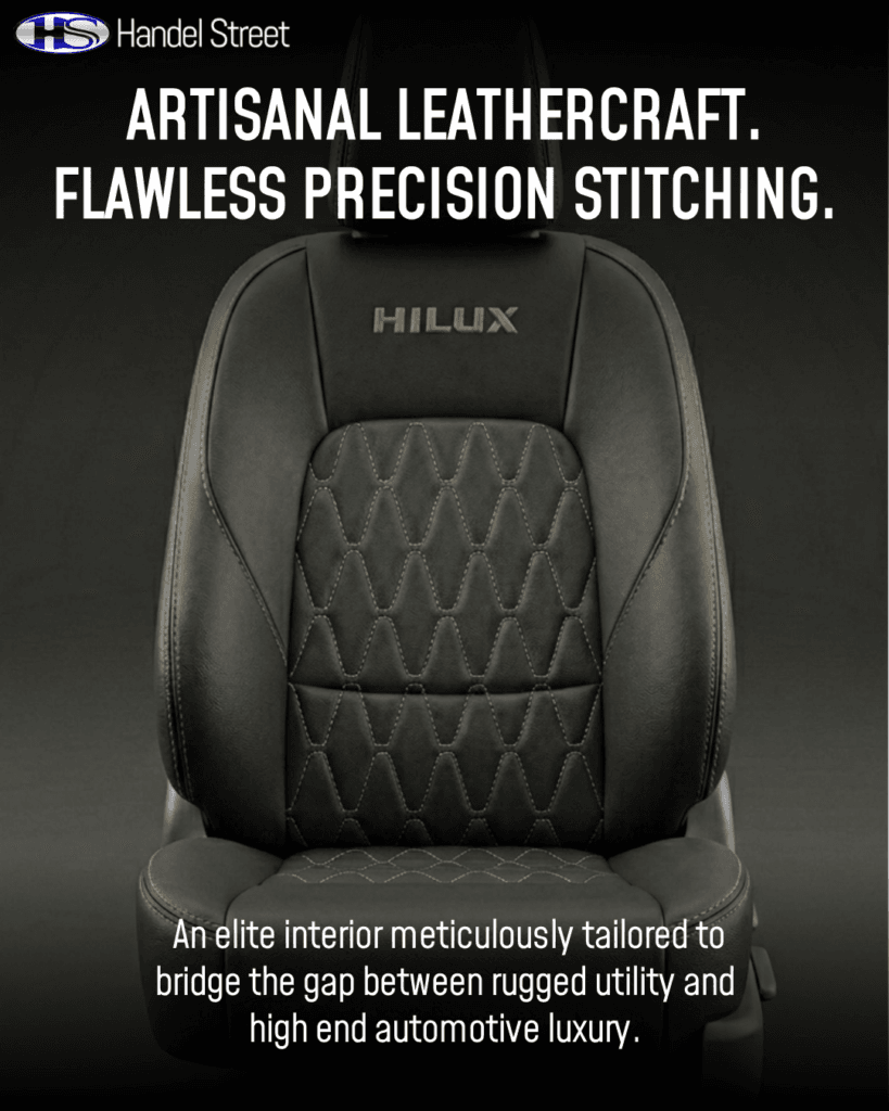 Symmetrical front-facing studio shot of a custom black genuine leather car seat featuring gold diamond-quilted center inserts and gold Hilux headrest embroidery.