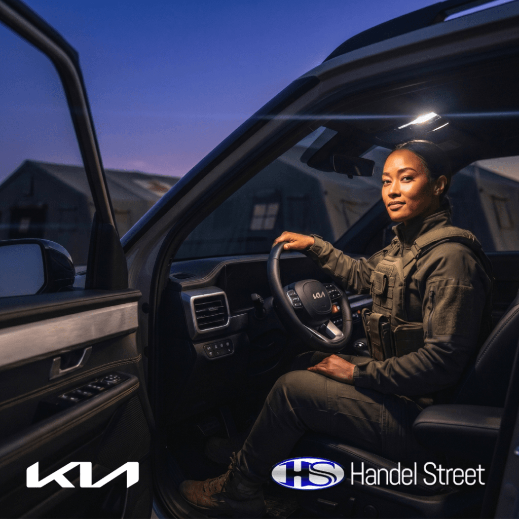 Kia Tasman campaign featuring a custom black leather vehicle interior by Handel Street Automotive with a female driver in tactical uniform at dusk.